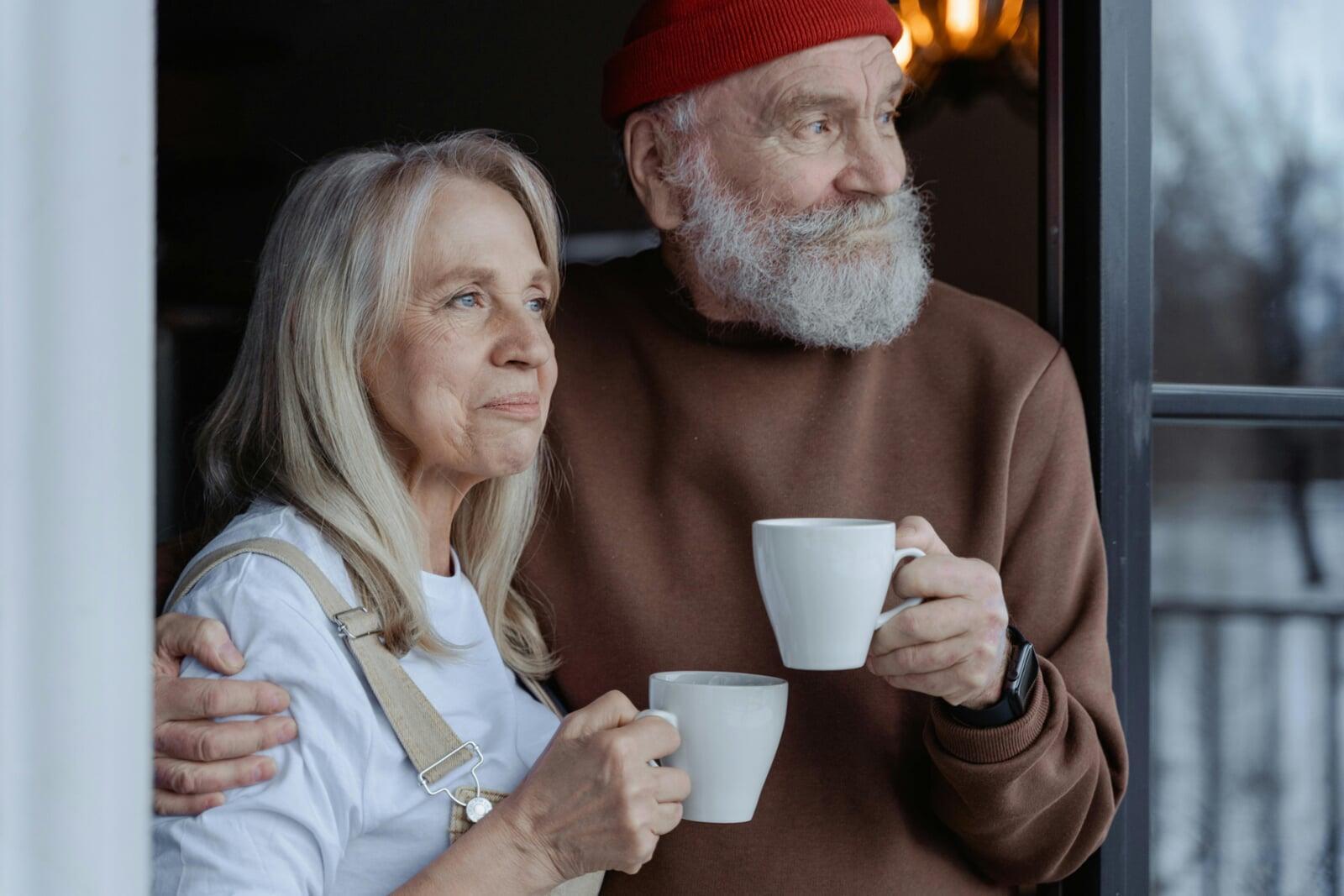 Senior couple dressed casually enjoying a couple of coffee